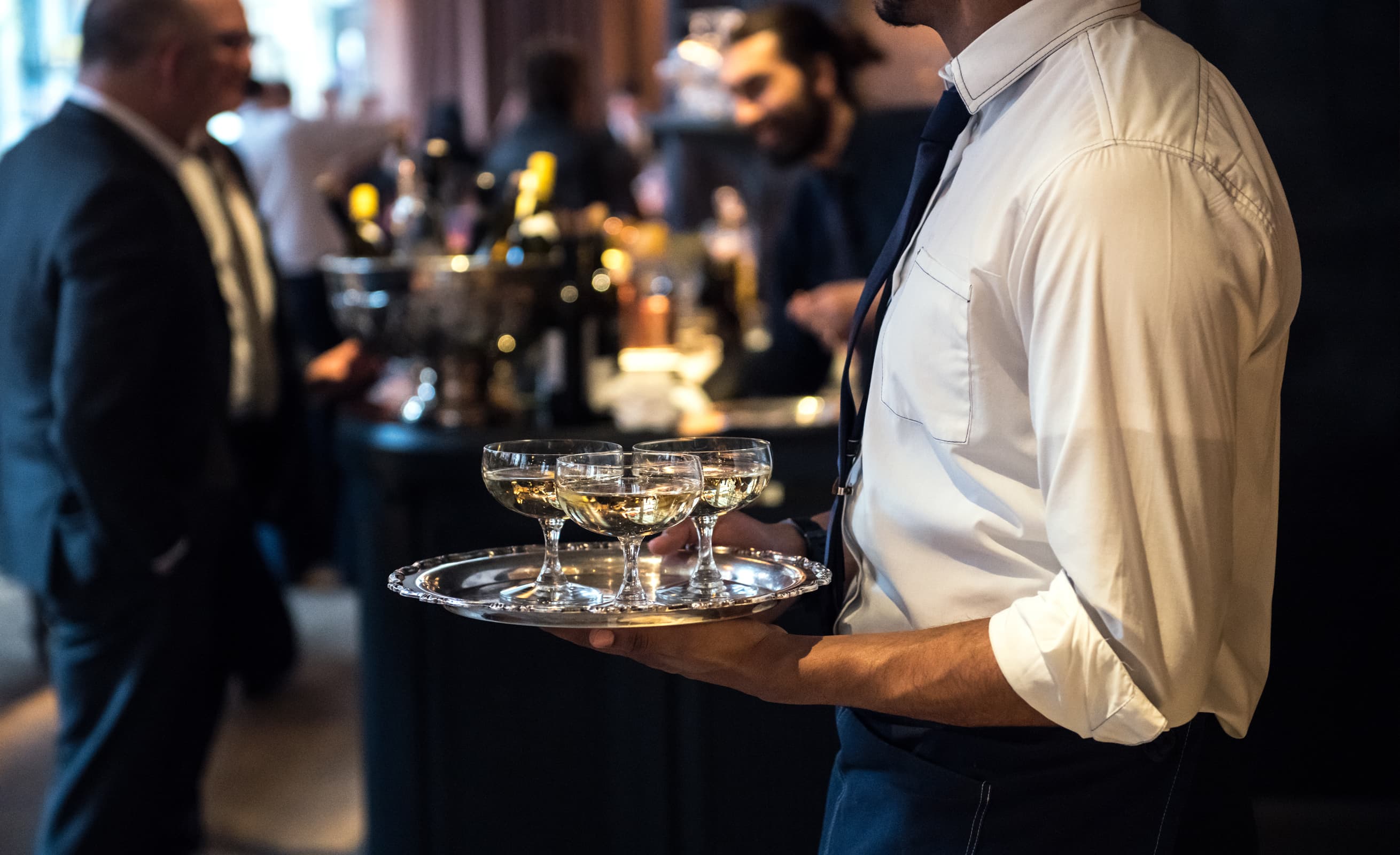 waiter serving Champagne at a wedding